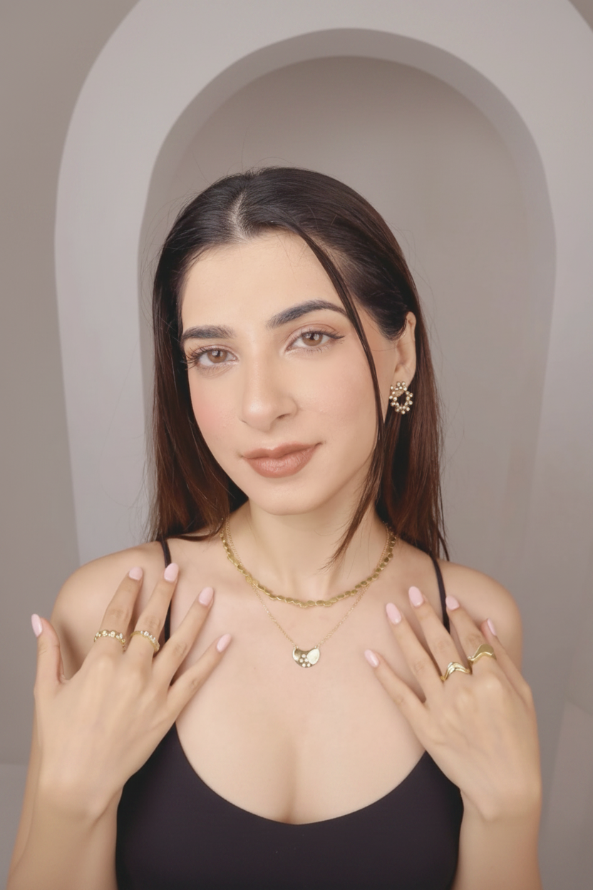 Model wearing Aurora Links, cropped to portrait